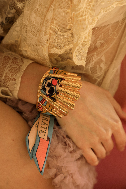 Shell cuff and colorful pirate ribbon
