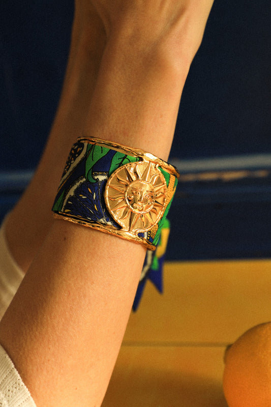 Sun cuff and blue cocktail ribbon