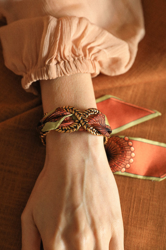 Braid and ribbon cuff in neutral shell