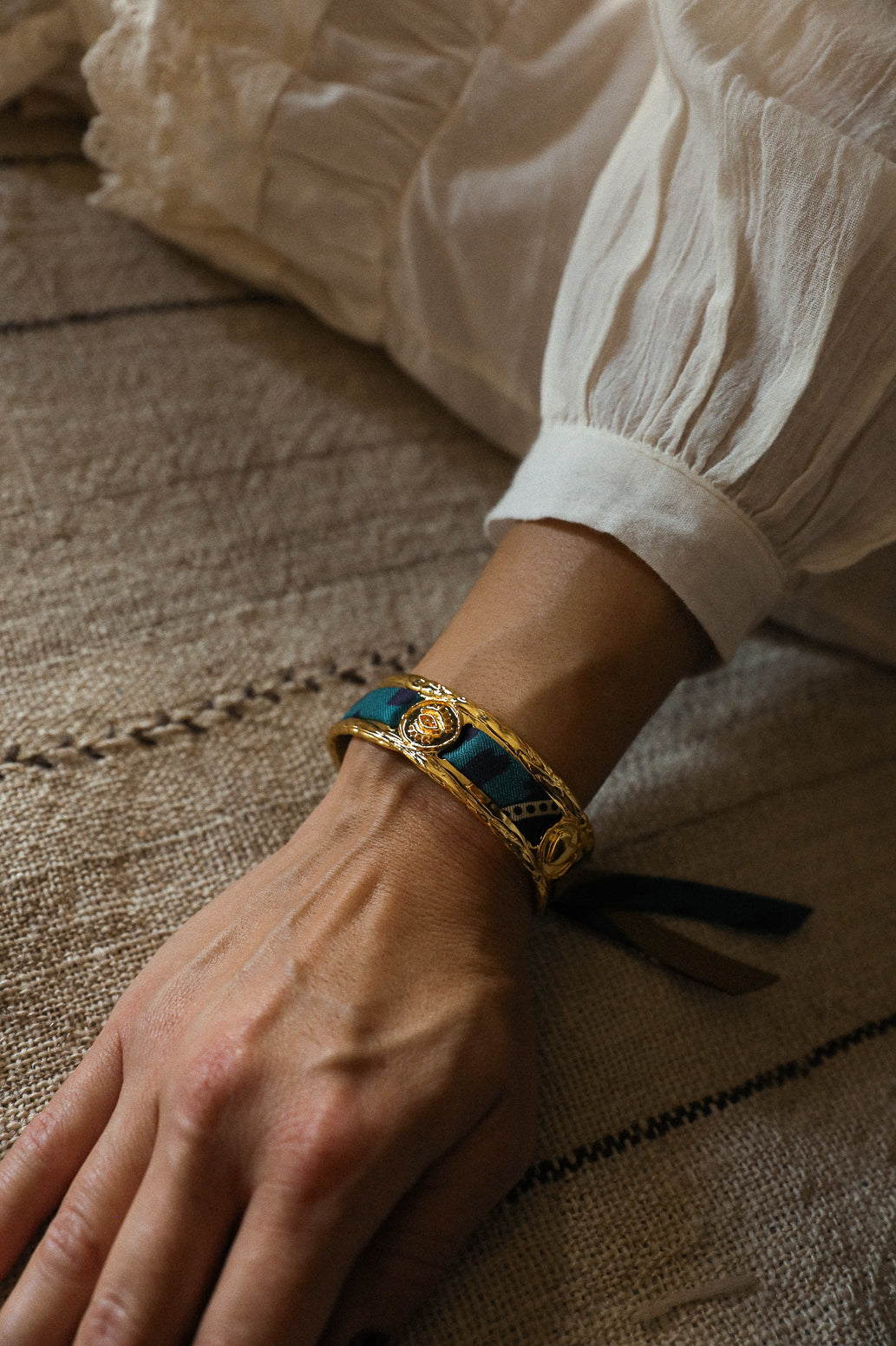 Irma cuff and its Chapanoir ribbon, olive