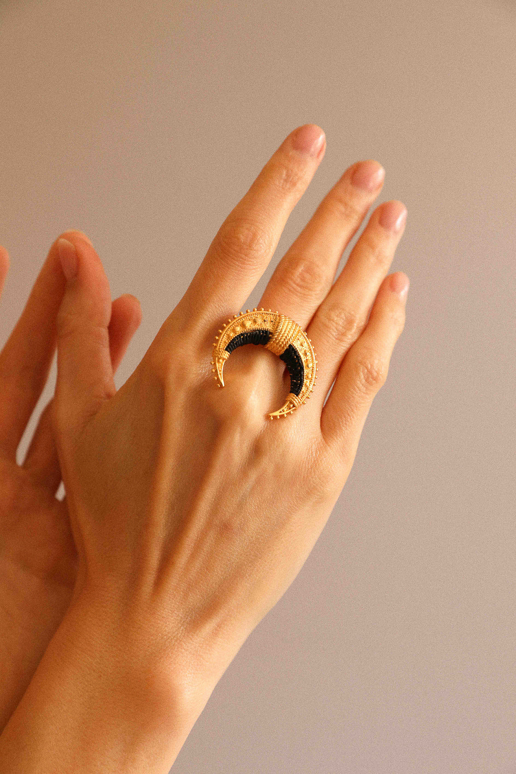 Moun ring, embroidered with black raffia